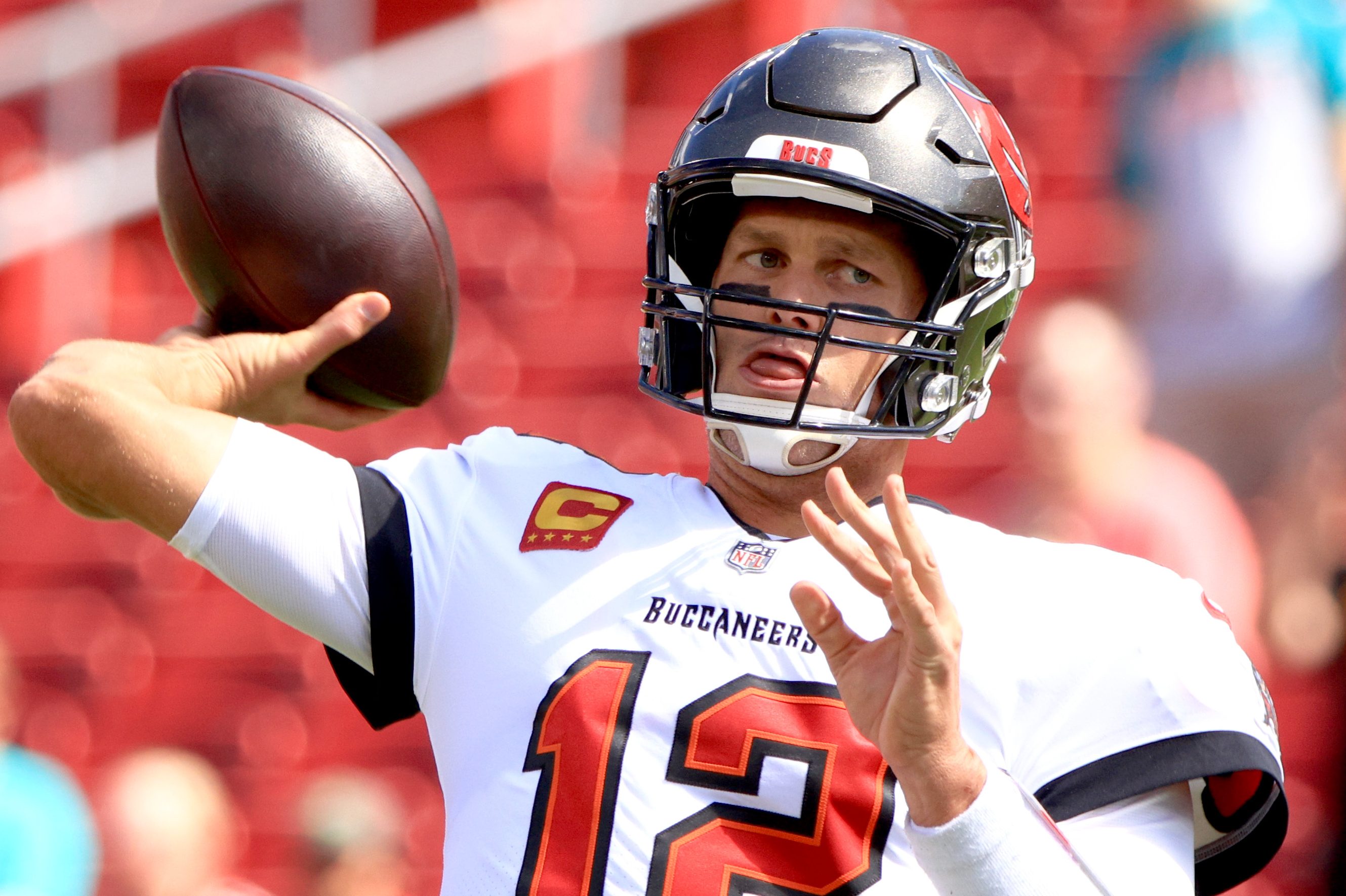 Tom Brady of the Tampa Bay Buccaneers warms up prior to a game against the Miami Dolphins