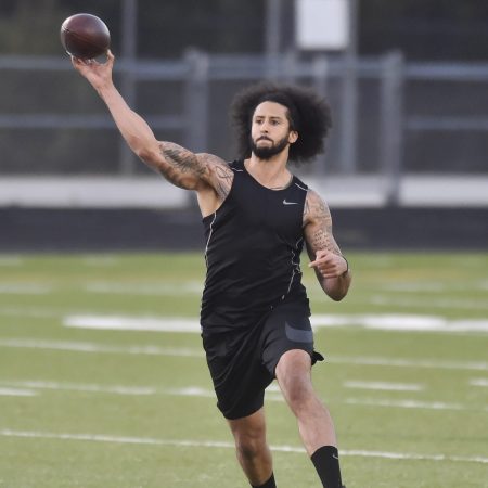 Former NFL quarterback Colin Kaepernick goes through a series of passing drills. The former 49ers quarterback says he's "still waiting" for another chance at the NFL as of March 2022.