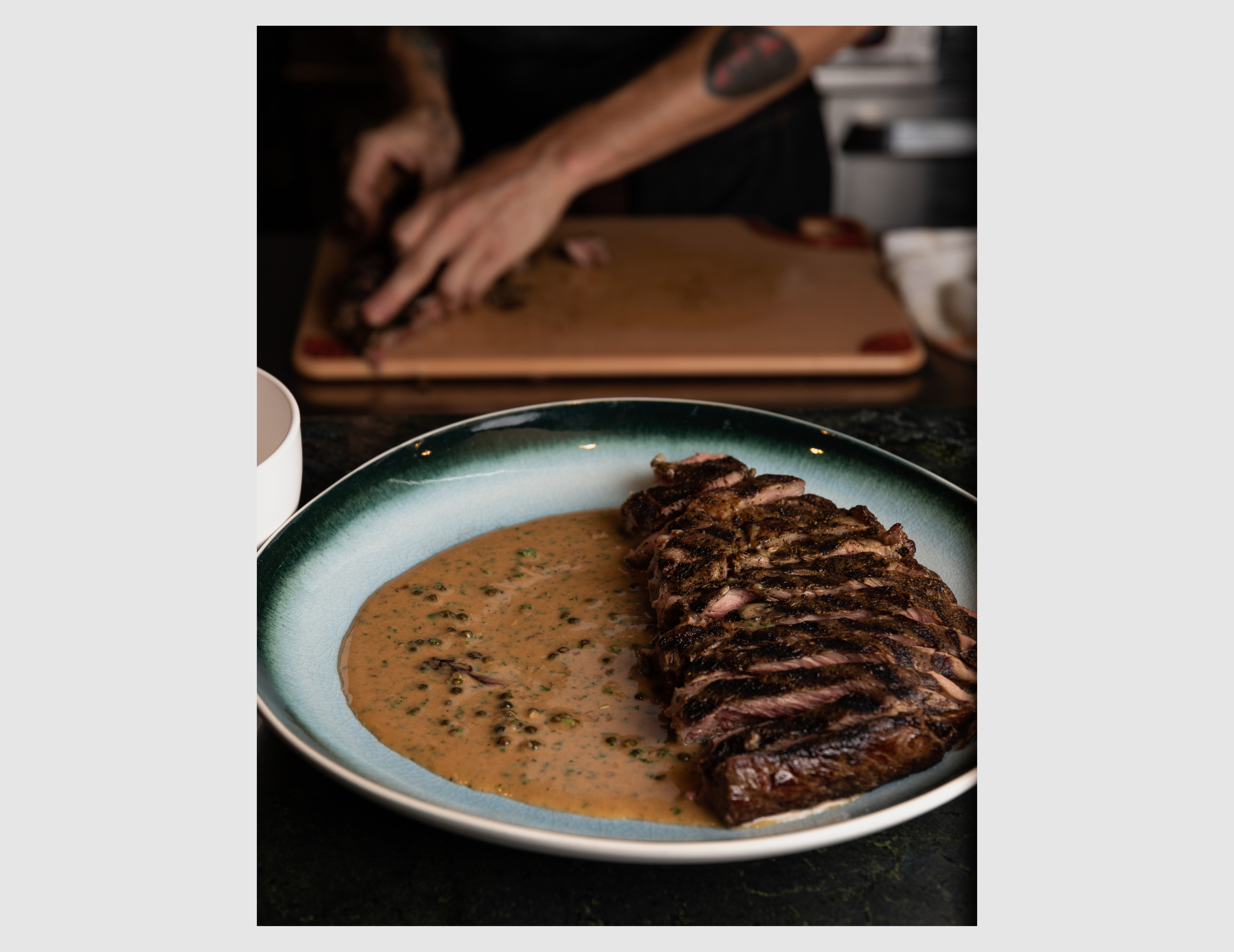 Preparing the steak au poivre at Jattö