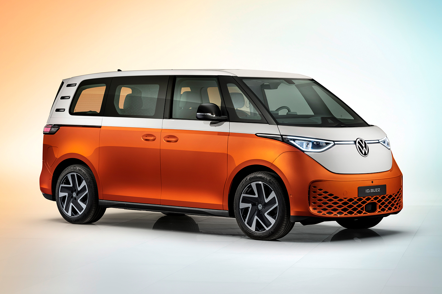 The new Volkswagen ID. Buzz in Candy White and Energetic Orange. The electric van, based on the iconic VW Microbus, was finally unveiled in March 2022.