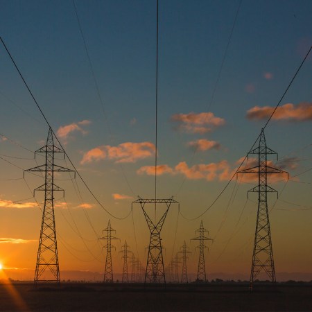 Power lines against a colorful sky.