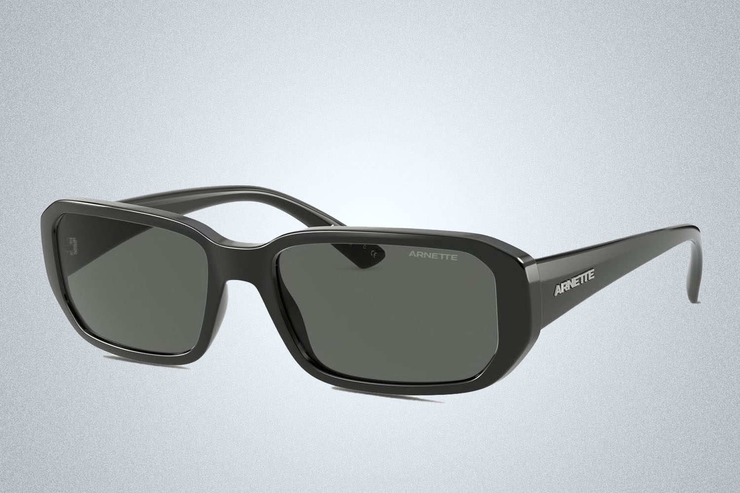 a pair of sunglasses on a grey background