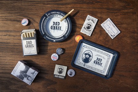 The Dad Grass and George Harrison "All Things Must Grass" collection, a lineup of CBD/CBG joints, rolling papers, ashtrays, rolling trays, pins, stickers and more