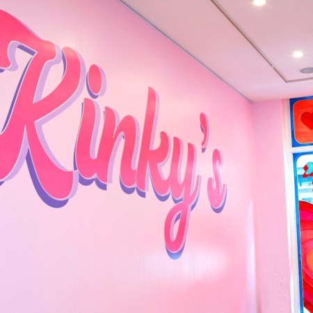 Pink and purple wall mural reads "Kinky's"