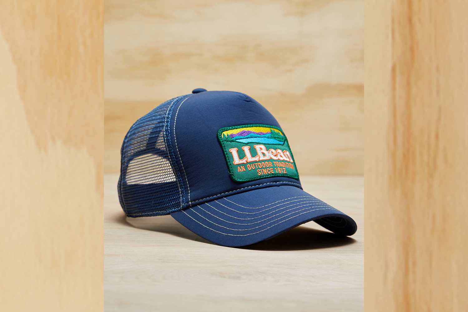 a mesh baseball hat on a wood background