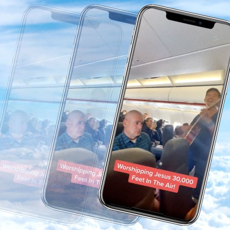 A smartphone with a screenshot of a TikTok video in which Christian evangelists perform a religious song on an EasyJet flight