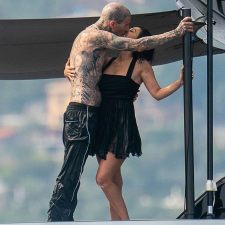 Kourtney Kardashian and Travis Barker make out on a boat in Italy