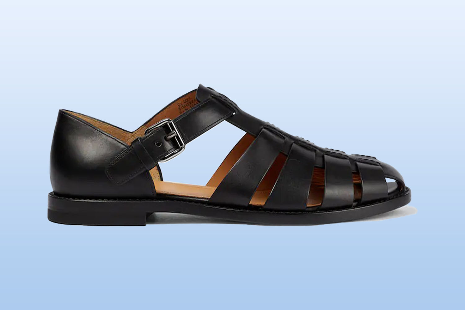 a black leather sandal from mytheresa on a light blue background