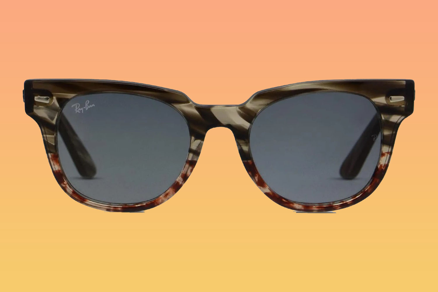 A pair of Ray-Ban sunglasses on a orange-to-yellow gradient background