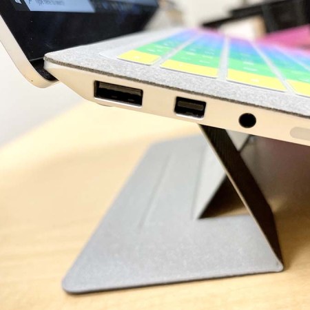 A close-up of the MOFT Invisible Laptop Stand on a computer