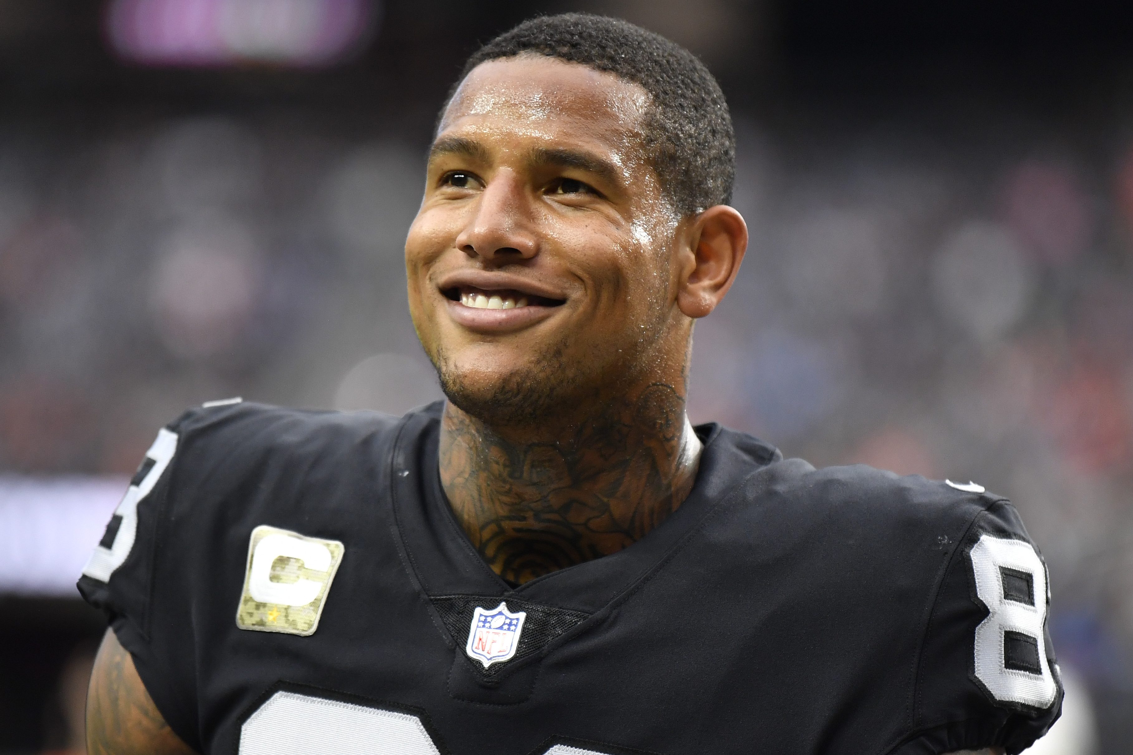 Darren Waller of the Las Vegas Raiders walks off the field after warmups before a game against the Bengals