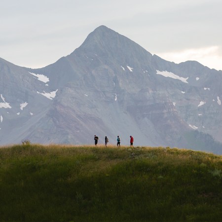 Four people hiking in Telluride, Colorado, as part of the Reset trekking retreat. We take a look at the wellness and luxury travel program, which opened in May 2022.