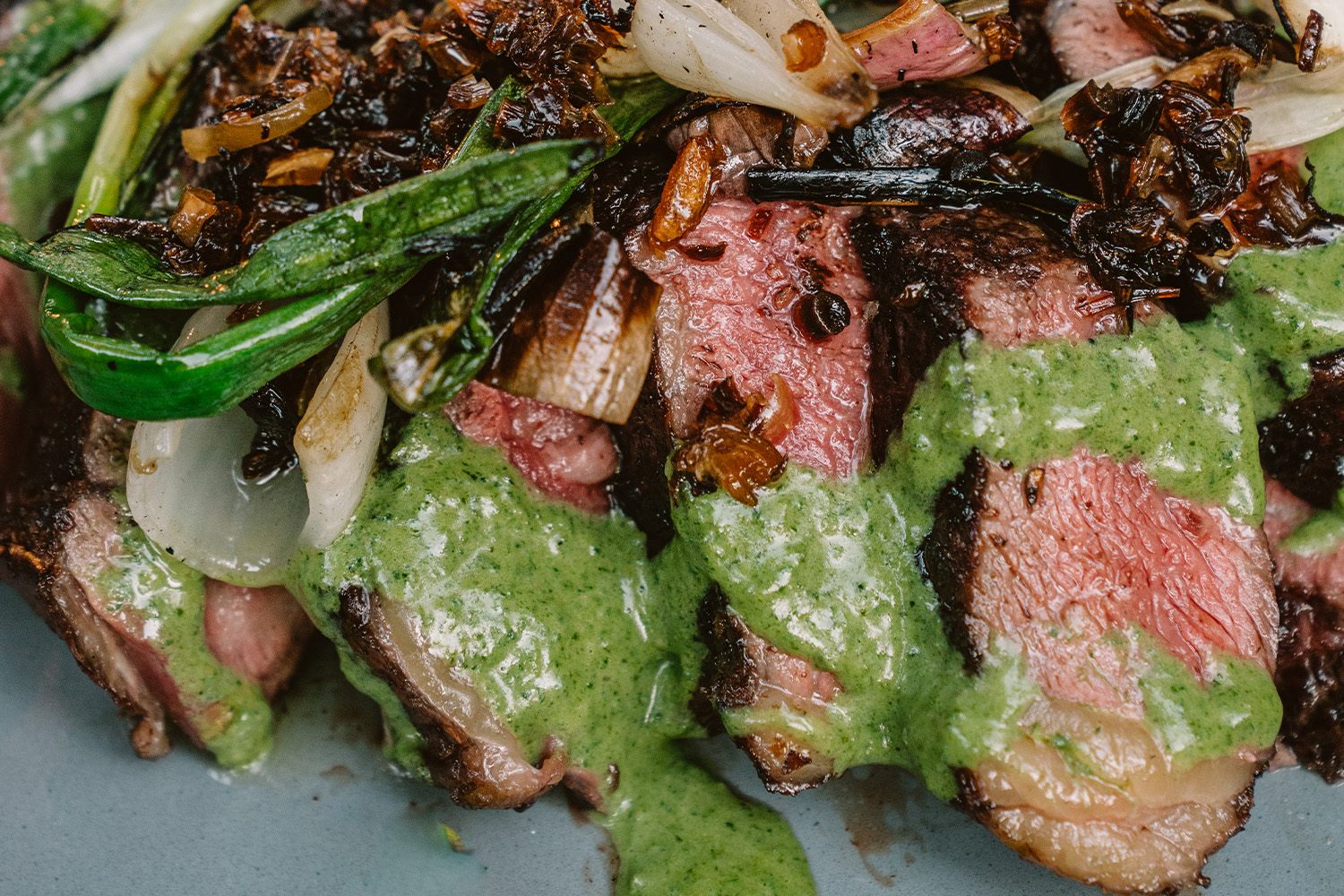 First Light Wagyu Ribeyes with Creamed Nettles and Roasted Spring Onions