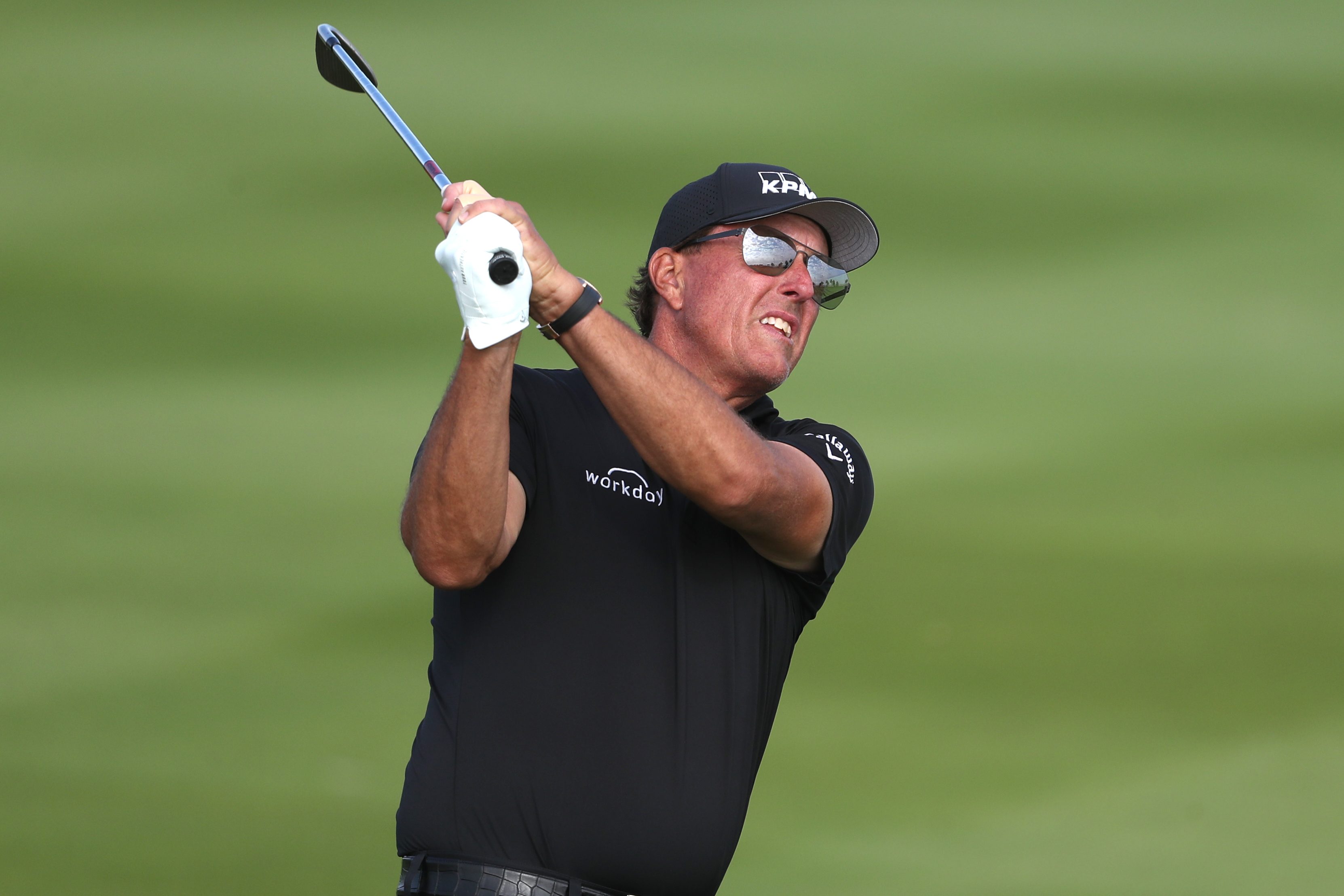 Phil Mickelson hits an approach shot on the 17th hole at the PIF Saudi International