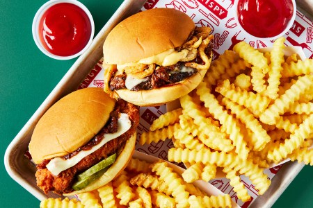 A plate of a Shake Shack burger, chicken sandwich, fries and ketchup. The sandwiches feature a new Maker's Mark bourbon bacon jam, and we got the recipe if you want to make it at home.