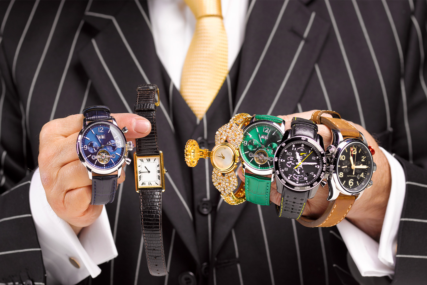 Man holding multiple watches