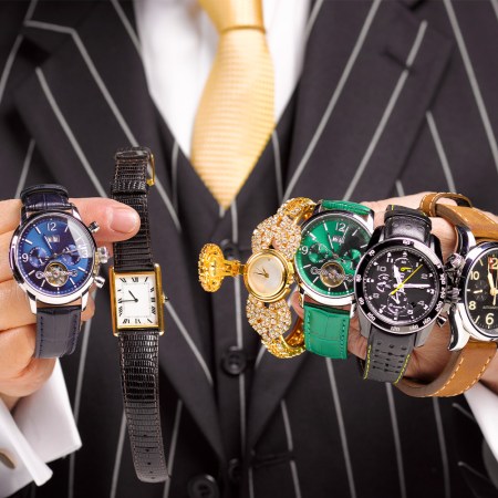 Man holding multiple watches