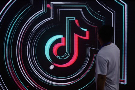 The TikTok logo on a screen.