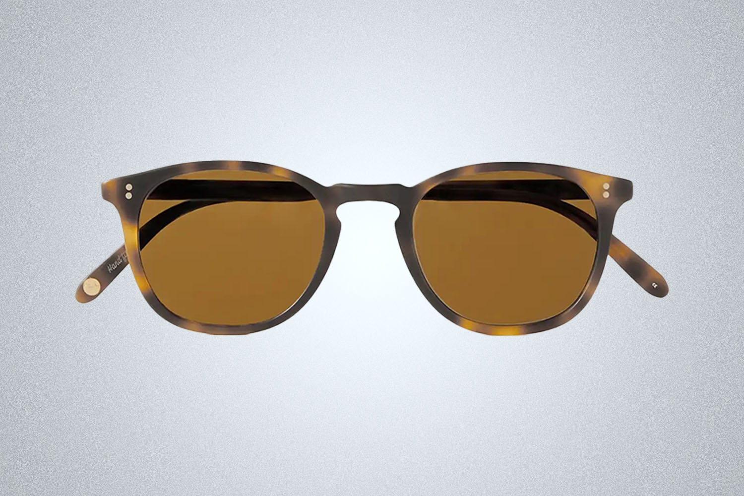 a pair of tortoisshell sunglasses from Garrett Leight on a grey background