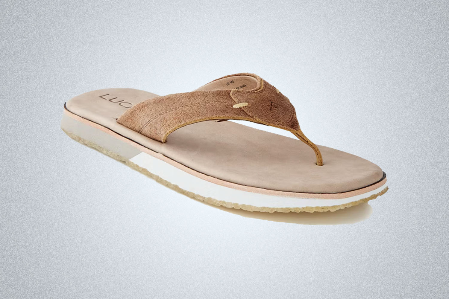 a light beige prong Luca sandal on a grey background