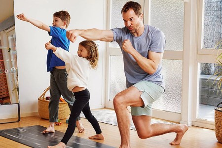 a dad and two children working out in lululemomo apparel