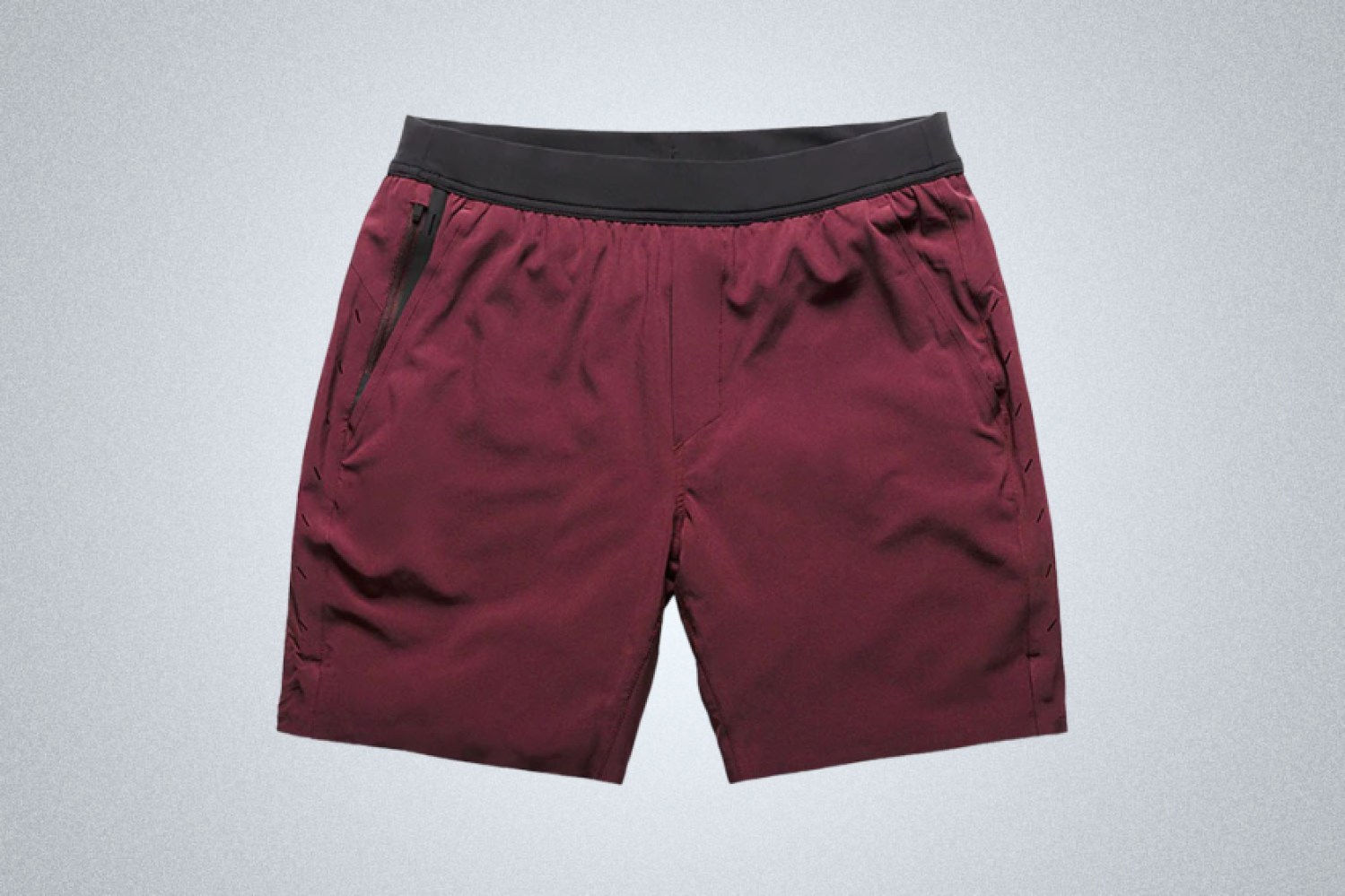 A pair of maroon Ten Thousand Interval Shorts on a grey background