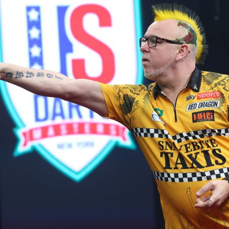 Peter Wright throws a dart in the opening round of the PDC Darts Championships.