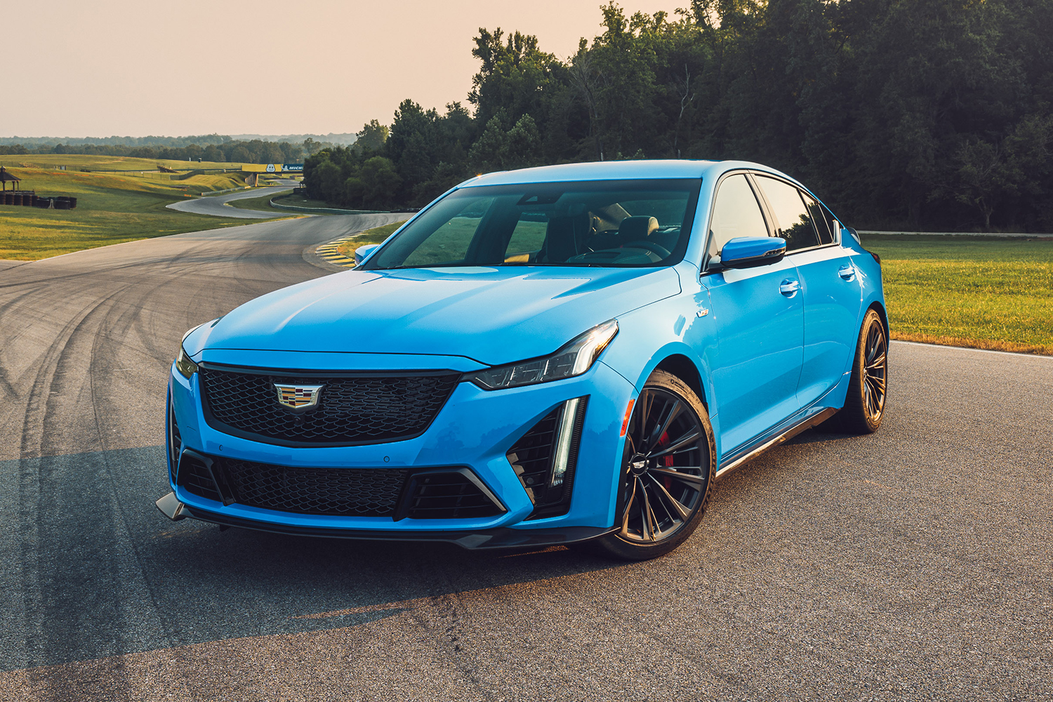 The 2022 Cadillac CT5-V Blackwing in blue sitting on a race track