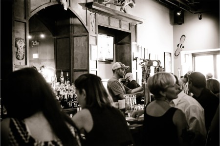 A black and white photo of the inside of Horse Thief Hollow, a brewery on Chicago's south side that you need to visit.