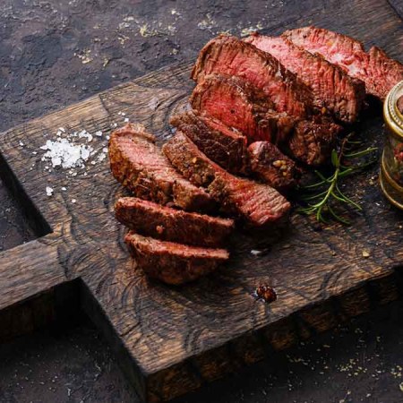 A sliced open steak from Crowd Cow on a serving platter