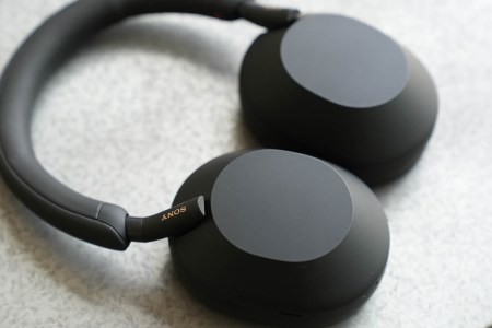 The black Sony WH-1000XM5 headphones lying on a table