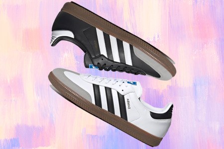 two Adidas Samba sneakers in black and white on a colored pastel background