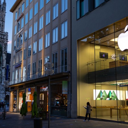 An Apple Inc. store illuminated in the evening in Munich, Germany, on Friday, June 10, 2022. New EU legislation will potentially alter how companies like Apple do business not just in the EU, but perhaps globally.