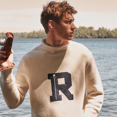 a model wearing the new J.Crew Fall 2022 collection in front of a lake