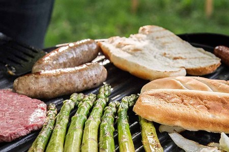 Food being cooked on a George Foreman Indoor/Outdoor Grill