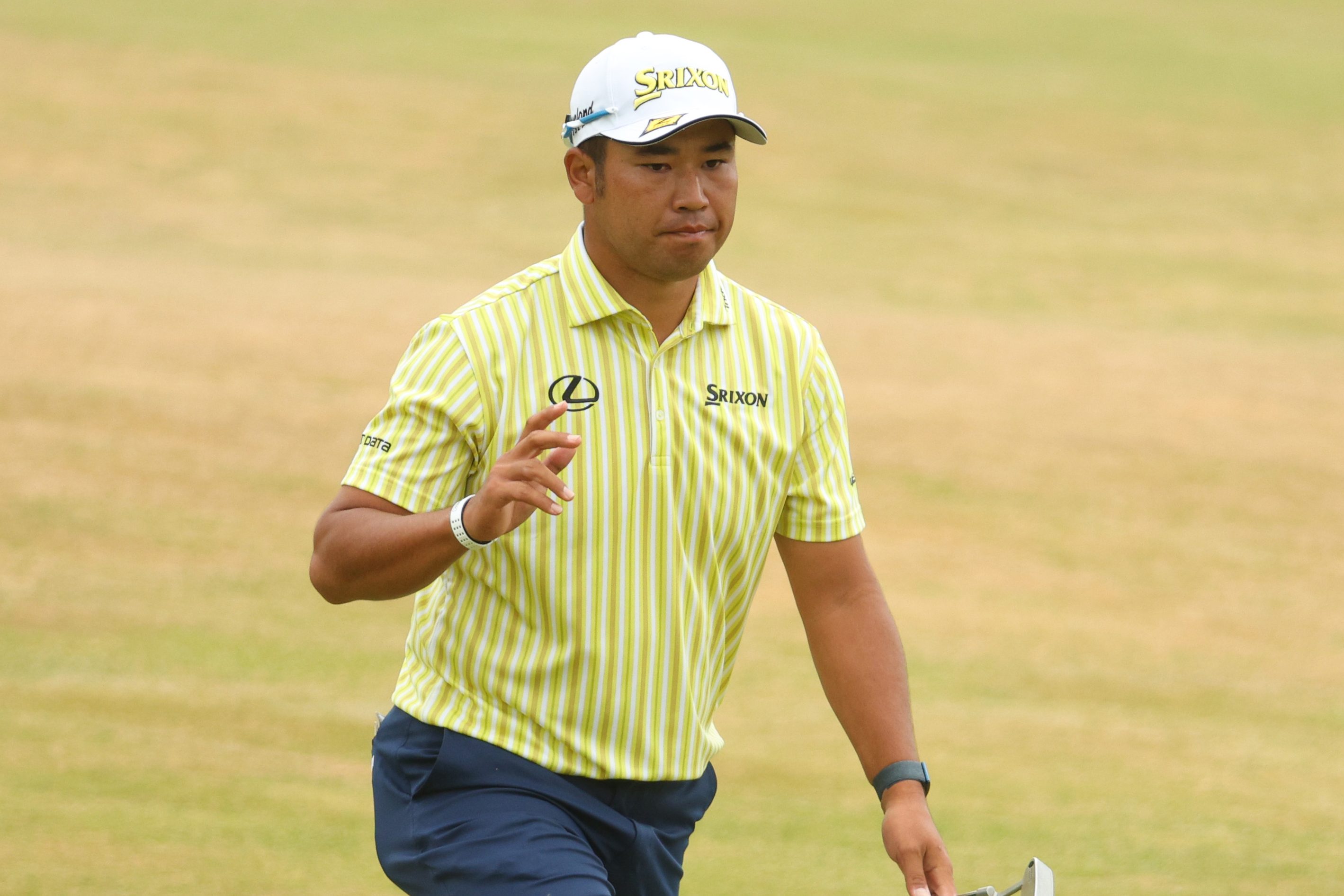 Hideki Matsuyama of Japan acknowledges the crowd on the 18th green at The 150th Open