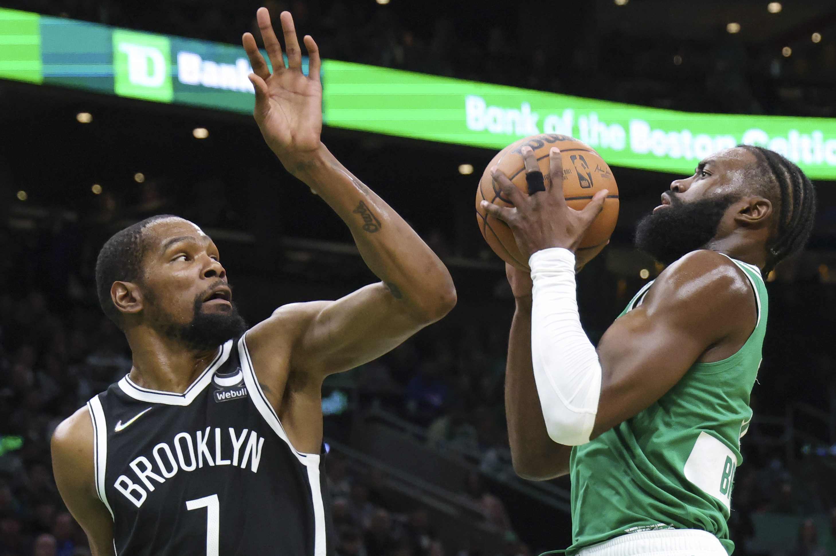 Jaylen Brown drives to the basket against Kevin Durant