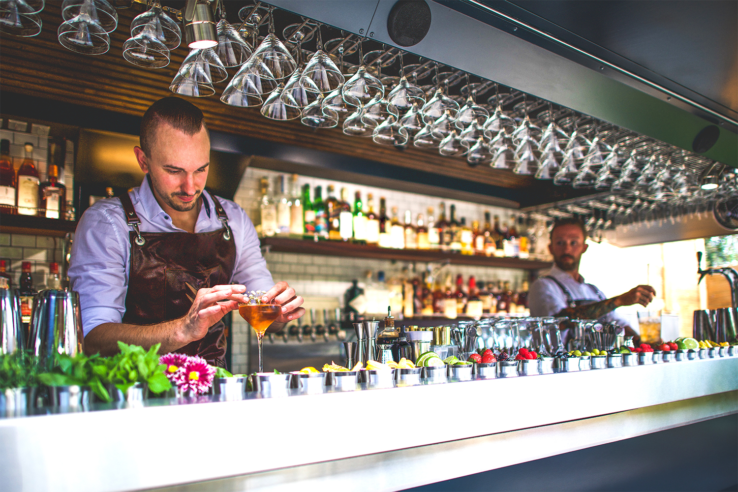 Justin Lavenue (left) and Dennis Gobis behind the RoadHaus bar from The Roosevelt Room in Austin, Texas