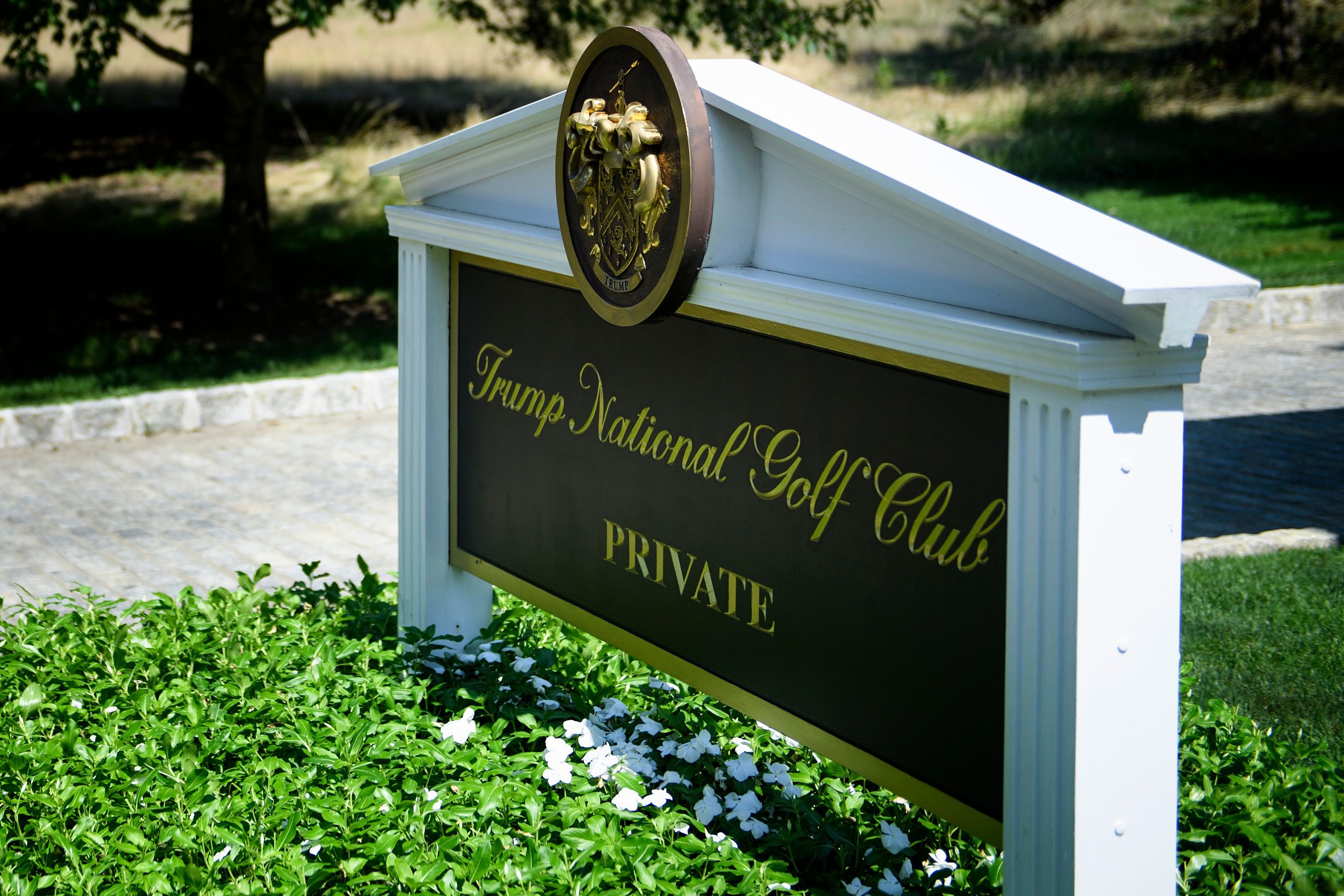 A sign is seen at an entrance to the Trump National Golf Club