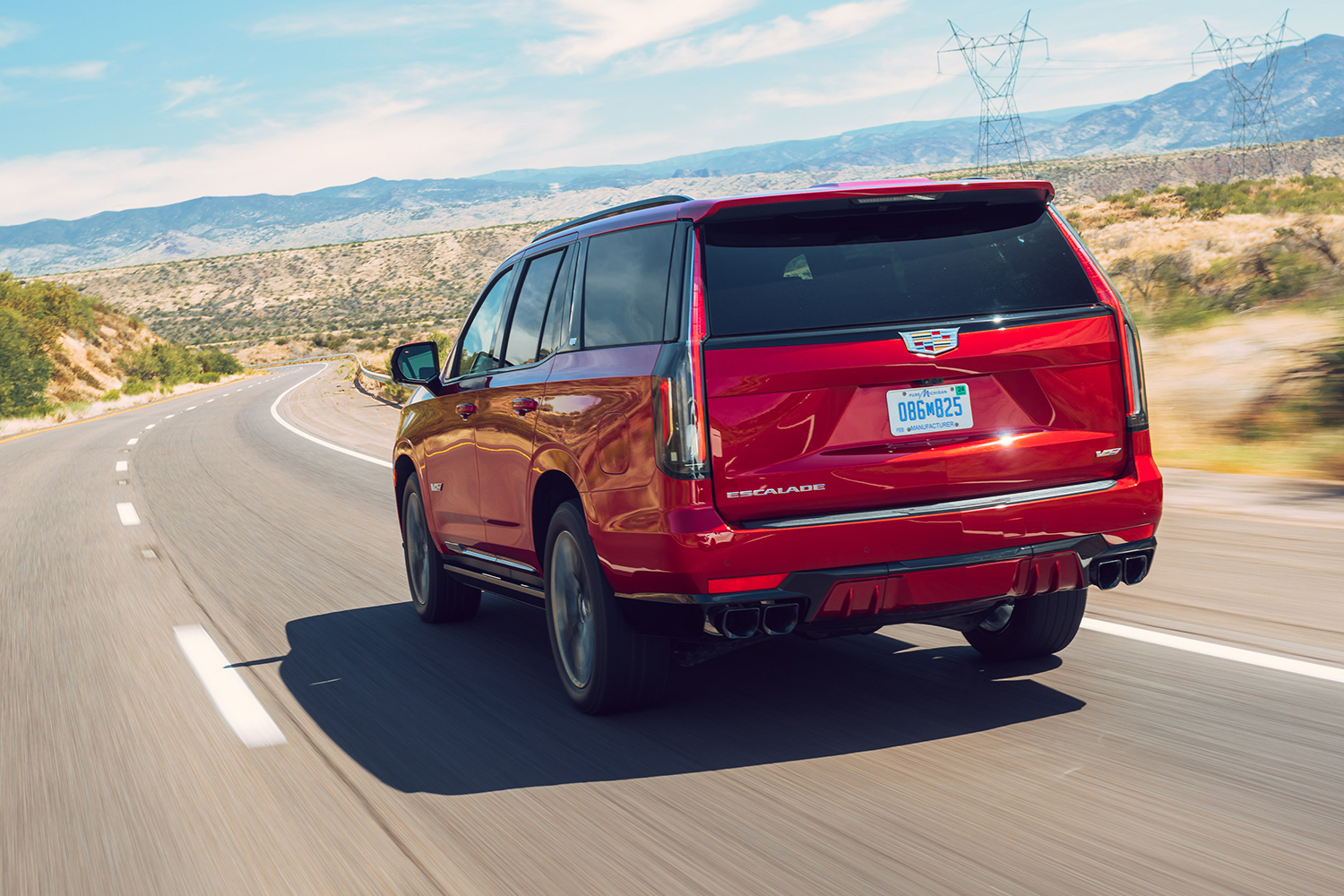 The rear end of the 2023 Cadillac Escalade-V SUV in red