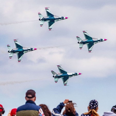 Spectators watch the U.S. Air Force Thunderbirds take to the sky during the Bethpage Air Show at Jones Beach in Wantagh, New York, on May 31, 2021