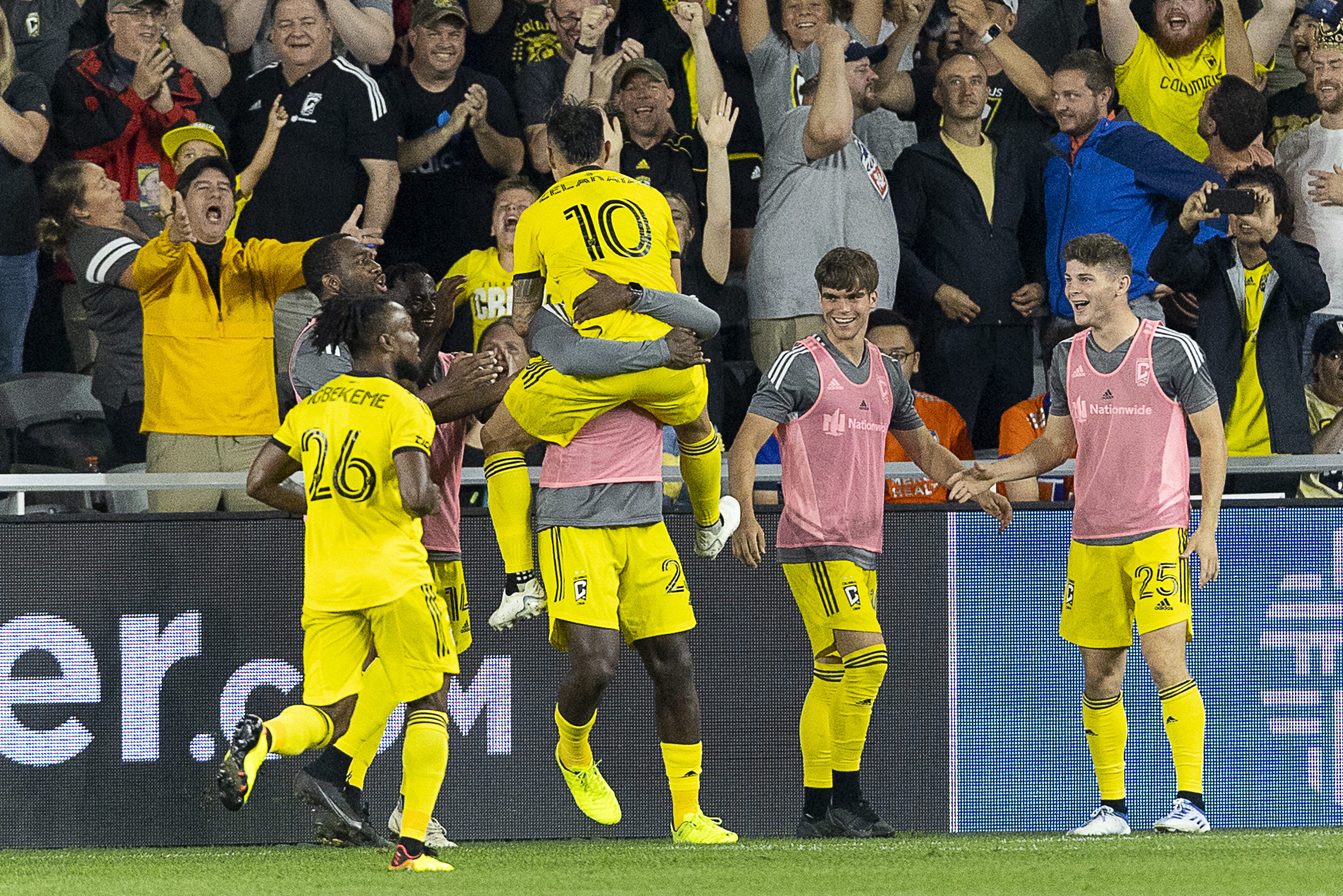 Columbus Crew/ players celebrate on the pitch.