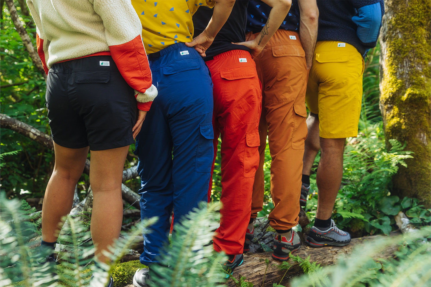 a photo of models wearing MEC gear in the forrest