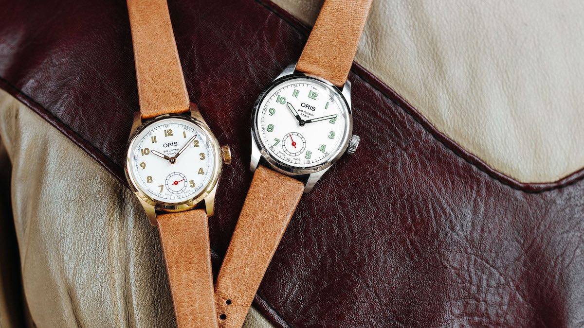 two watches on a leather jacket from Oris