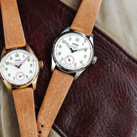 two watches on a leather jacket from Oris