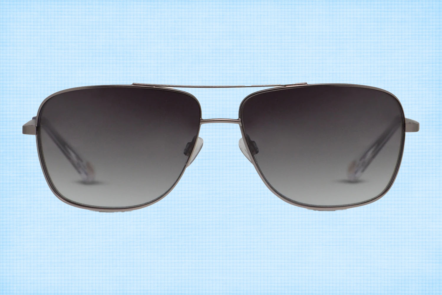 a pair of Ottoto aviator sunglasses on a light blue background