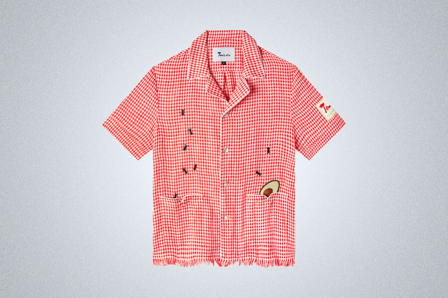 a red checked shirt with ant graphics from Tombolo on a grey background