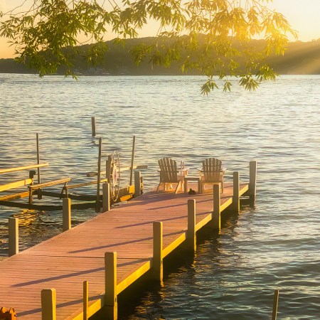 Lake Geneva Pier with Chairs at Sunset