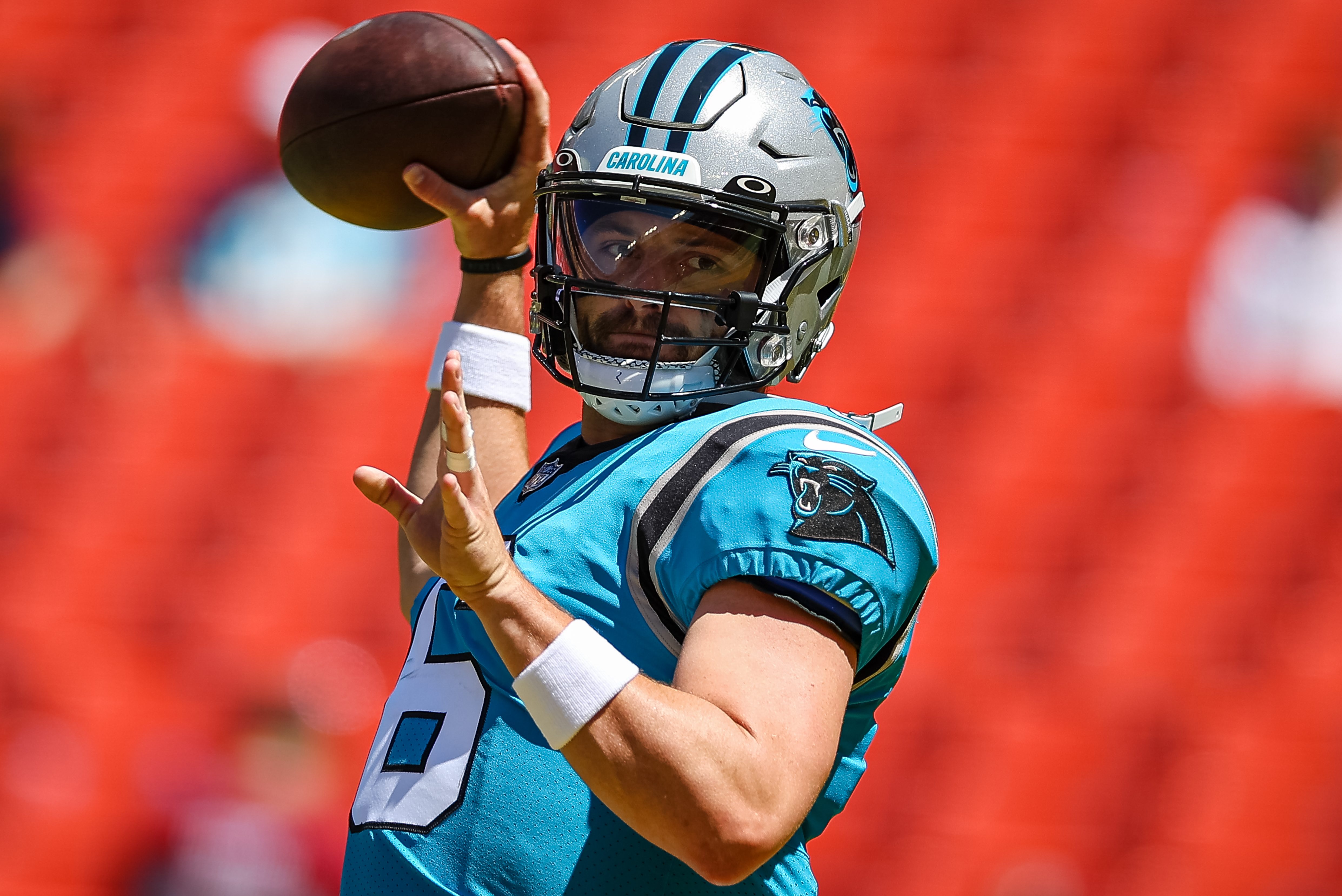 Baker Mayfield throws a pass before a preseason game against the Commanders.