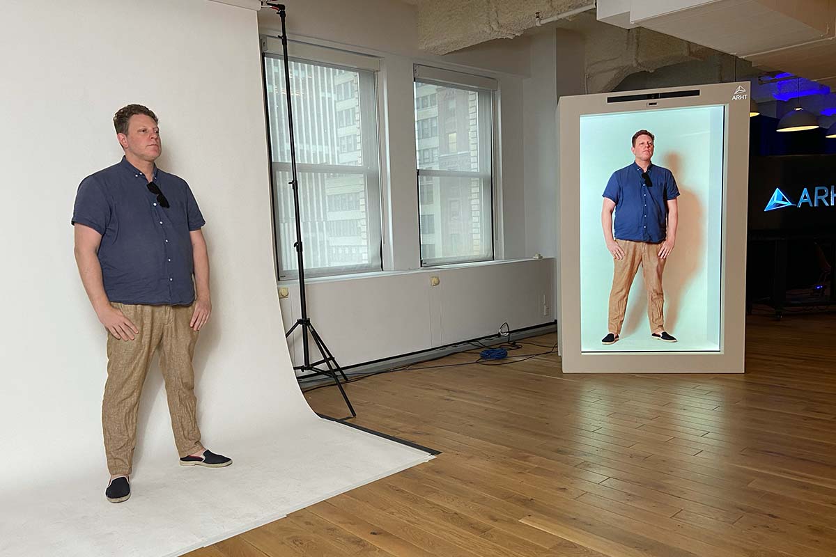 A man in a studio utilizing ARHT's Capule hologram tech